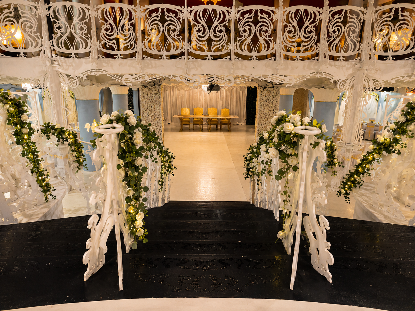 Grand white Art Nouveau staircase entrance with white rose garlands leading into the Opulent @ 35 Liverpool ballroom